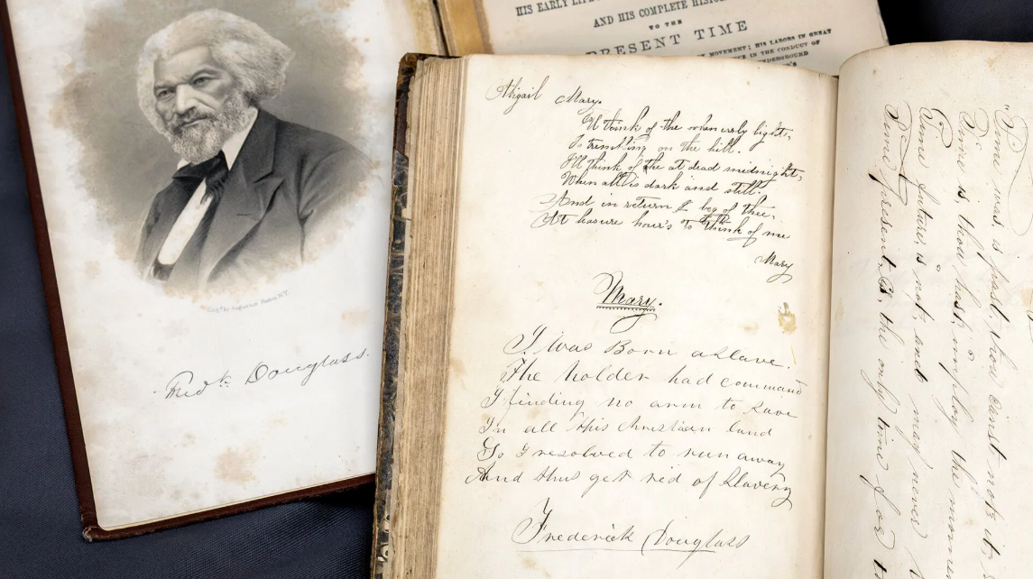 Image of Frederick Douglass and some books with writing