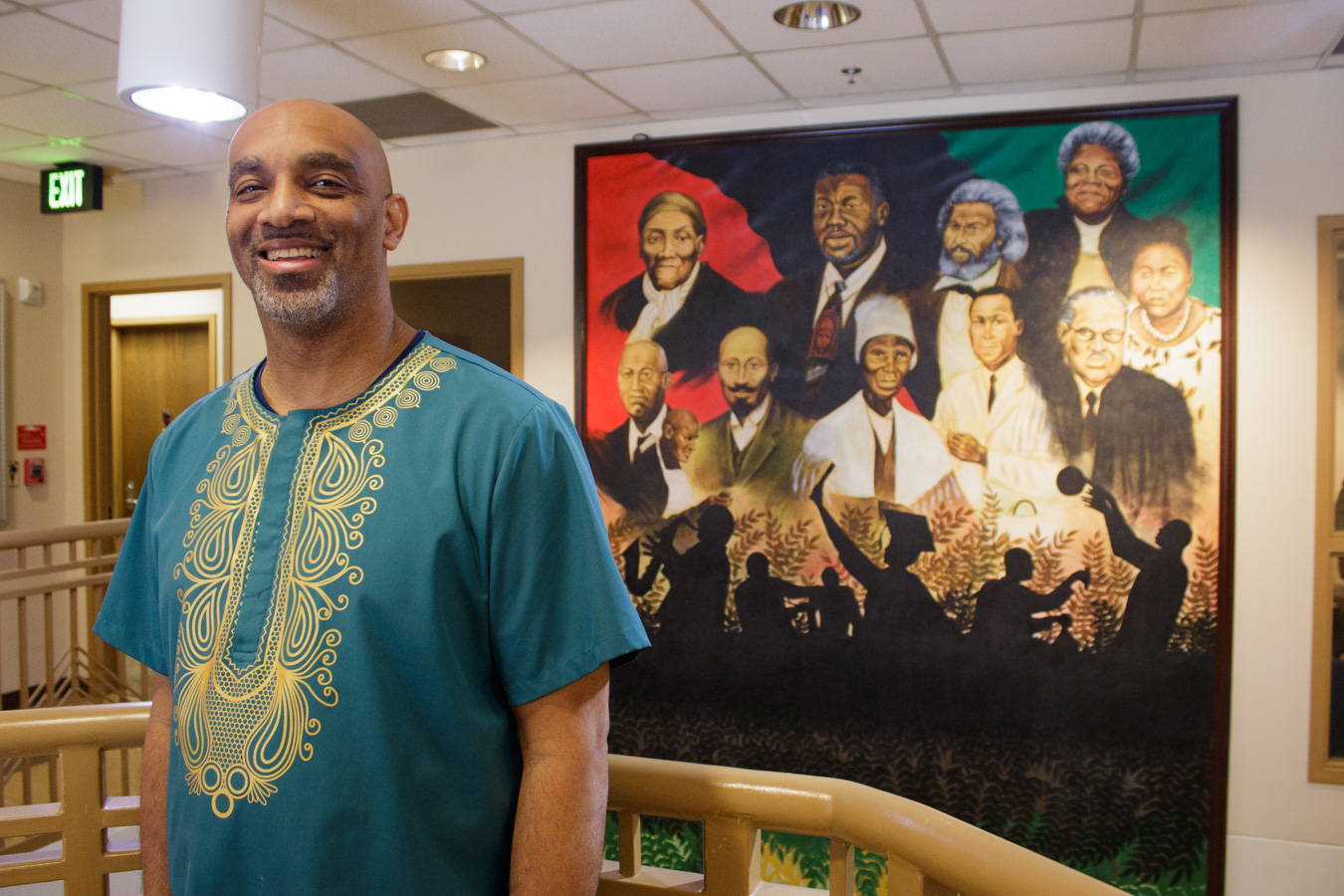 Man standing in front of painting