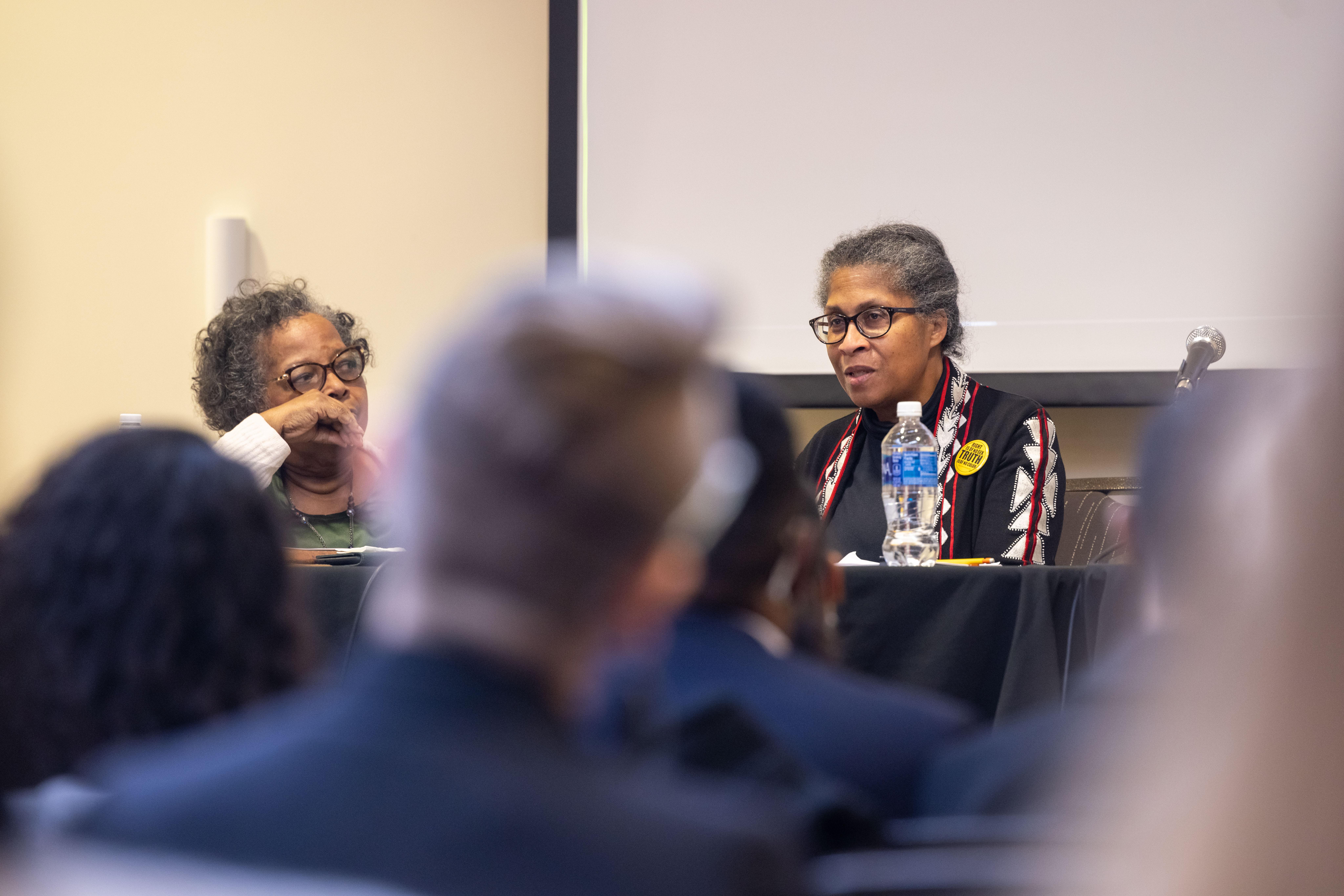 woman addressing audience